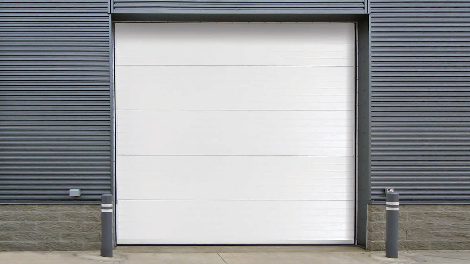Commercial garage door repair service addressing sectional and rolling steel doors in a warehouse setting