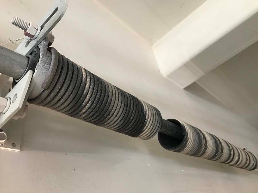 An image of torsion springs used in a garage door system, ideal for those needing garage door spring repair.