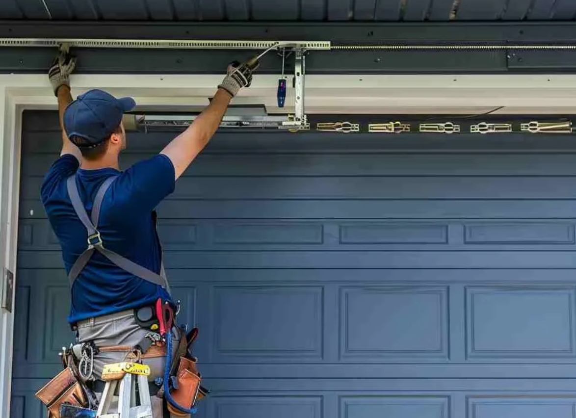 Technician performing garage door repair service in Bradenton - enhancing safety and functionality for residential properties.