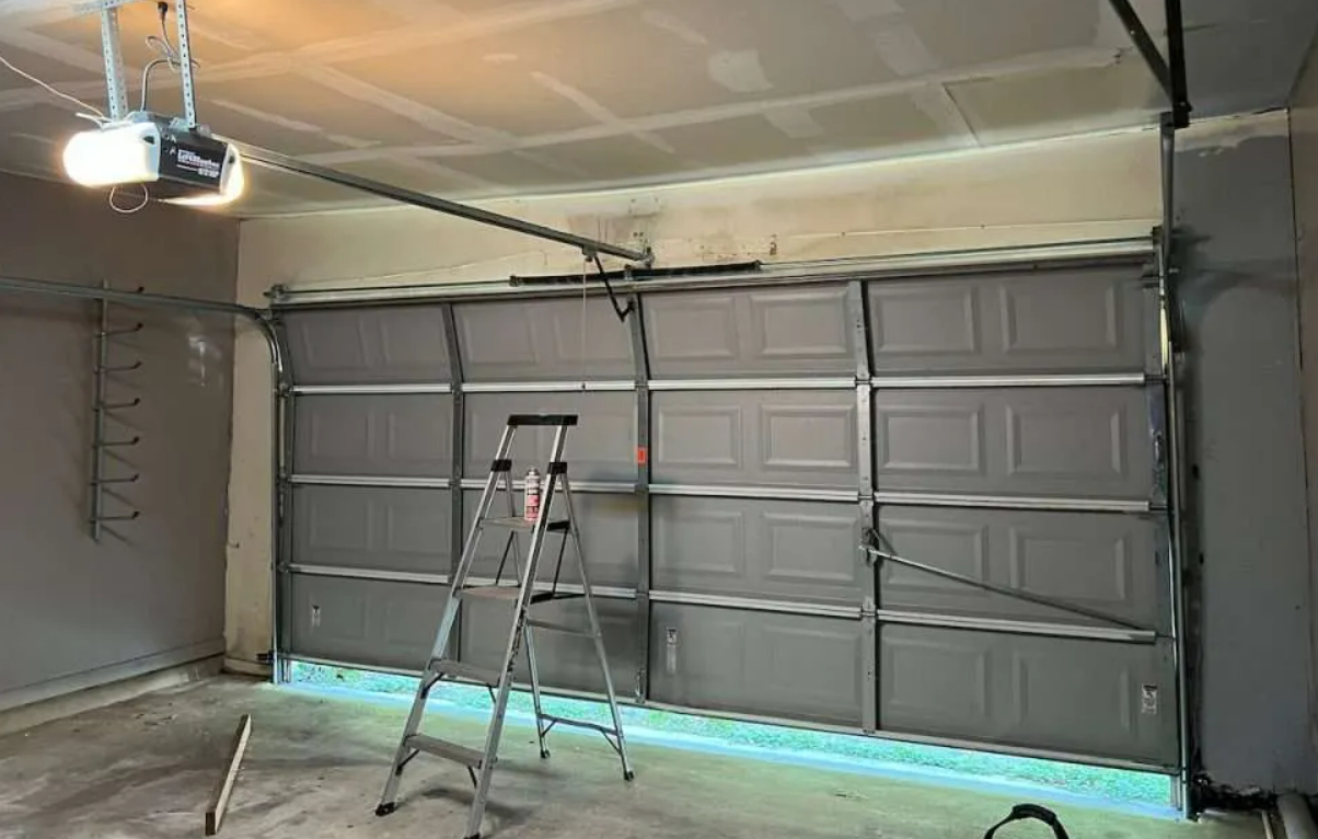 Professional technician performing garage door repair service in Bradenton